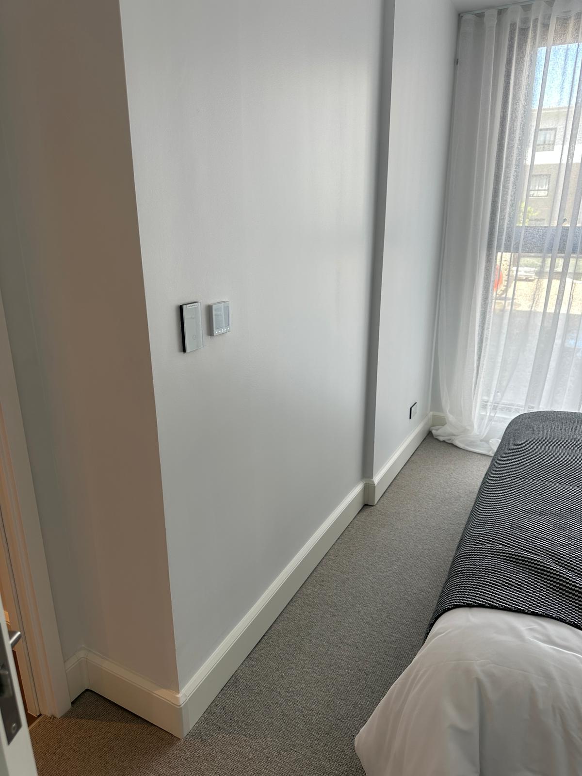 Bedroom with thermostat controls