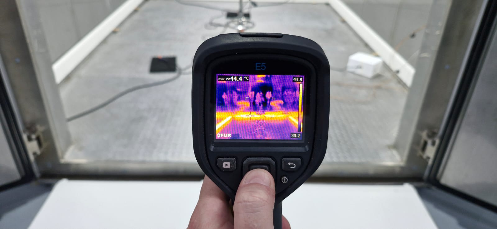 FLIR thermal imaging showing HeatENE heat distribution at 131°F